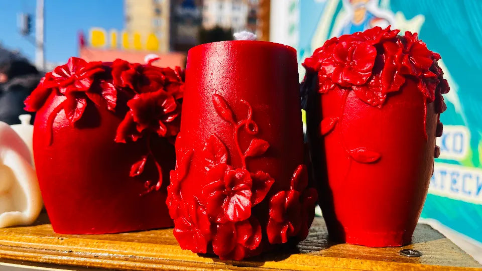 Pouring melted beeswax into molds during a workshop in Sofia