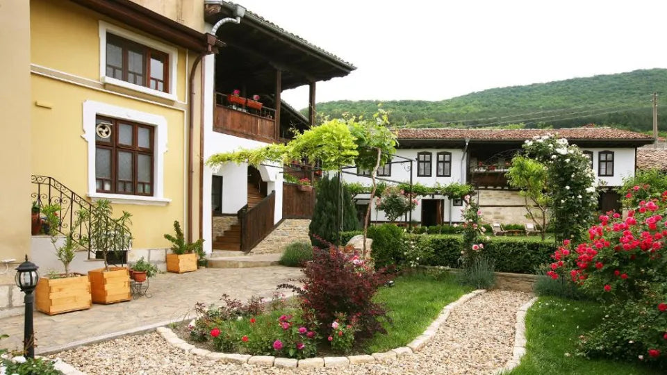 Courtyard seating under the vine arbour at Osmarski Houses, Osmar