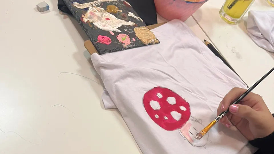 Child painting a nature-themed picture during a kids’ art class in Burgas