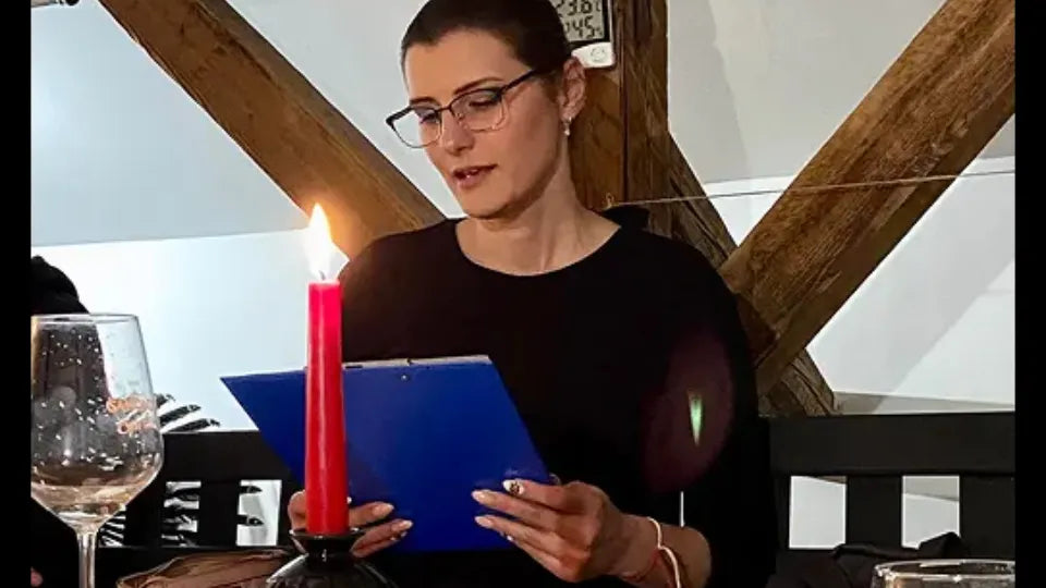 Participants writing by hand during a creative evening in Burgas