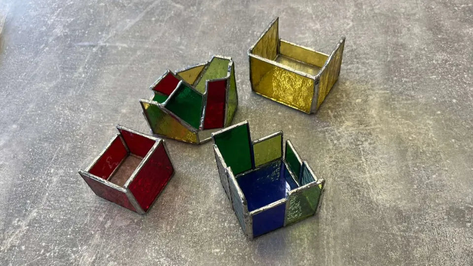 Cutting and soldering glass pieces in a Tiffany stained glass class, Veliko Tarnovo